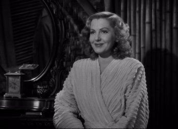 Movie still from “Only Angels Have Wings” (1939), directed by Howard Hawks – A black and white photo of a woman in a robe; Close Up shot, Over the shoulder angle