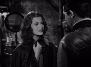 Movie still from “Only Angels Have Wings” (1939), directed by Howard Hawks – A man and a woman standing next to each other; Close Up shot, Over the shoulder angle