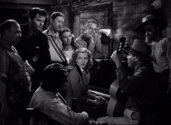 Movie still from “Only Angels Have Wings” (1939), directed by Howard Hawks – A black and white photo of a group of people; Wide shot, High angle