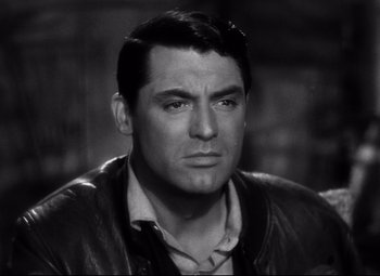 Movie still from “Only Angels Have Wings” (1939), directed by Howard Hawks – Black and white photograph of a man in a leather jacket; Close Up shot, Over the shoulder angle