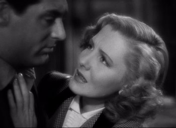 Movie still from “Only Angels Have Wings” (1939), directed by Howard Hawks – A man and a woman looking at one another; Close Up shot, High angle