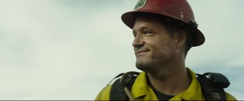 Movie still from “Only the Brave” (2017), directed by Joseph Kosinski – A person wearing a helmet; Close Up shot, Low angle