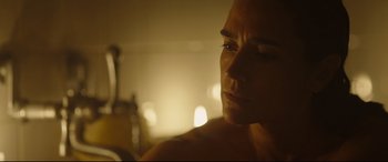 Movie still from “Only the Brave” (2017), directed by Joseph Kosinski – A woman's face in a dimly - lit room; Close Up shot, Over the shoulder angle