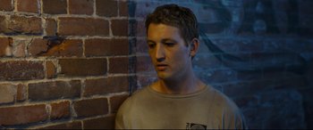 Movie still from “Only the Brave” (2017), directed by Joseph Kosinski – A man standing in front of a brick wall; Close Up shot, High angle