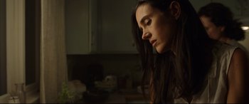 Movie still from “Only the Brave” (2017), directed by Joseph Kosinski – A person with long dark hair; Close Up shot, Low angle
