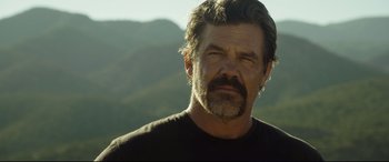 Movie still from “Only the Brave” (2017), directed by Joseph Kosinski – A person wearing a black shirt; Close Up shot, Over the shoulder angle