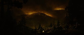 Movie still from “Only the Brave” (2017), directed by Joseph Kosinski – A group of people sitting on top of a hill; Extreme Wide shot, High angle