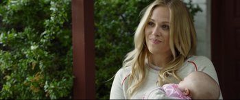 Movie still from “Only the Brave” (2017), directed by Joseph Kosinski – A beautiful blonde woman with long hair; Close Up shot, Over the shoulder angle