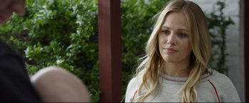 Movie still from “Only the Brave” (2017), directed by Joseph Kosinski – A person with long blonde hair; Close Up shot, Over the shoulder angle