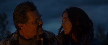 Movie still from “Only the Brave” (2017), directed by Joseph Kosinski – A man and a woman face to face in the dark; Close Up shot, Low angle