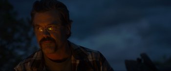 Movie still from “Only the Brave” (2017), directed by Joseph Kosinski – A person with a light on his head; Close Up shot, Low angle