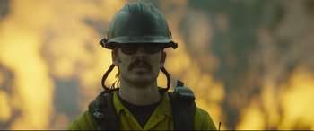 Movie still from “Only the Brave” (2017), directed by Joseph Kosinski – A person wearing a helmet; Close Up shot, Low angle