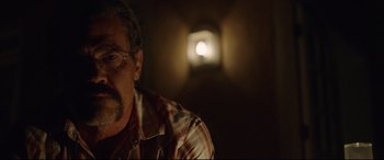 Movie still from “Only the Brave” (2017), directed by Joseph Kosinski – A person wearing glasses and a plaid shirt; Close Up shot, Over the shoulder angle