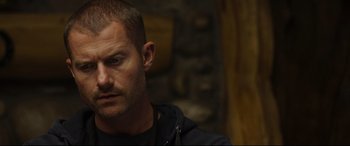 Movie still from “Only the Brave” (2017), directed by Joseph Kosinski – A person wearing a black jacket; Close Up shot, Over the shoulder angle