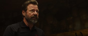 Movie still from “Only the Brave” (2017), directed by Joseph Kosinski – A man with a long beard and a mustache; Close Up shot, Over the shoulder angle