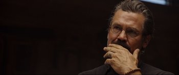 Movie still from “Only the Brave” (2017), directed by Joseph Kosinski – A person with a hand on his chin; Close Up shot, Over the shoulder angle