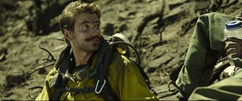 Movie still from “Only the Brave” (2017), directed by Joseph Kosinski – A person with a backpack; Close Up shot, Over the shoulder angle