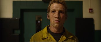 Movie still from “Only the Brave” (2017), directed by Joseph Kosinski – A person wearing a yellow jacket; Close Up shot, Low angle