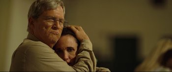 Movie still from “Only the Brave” (2017), directed by Joseph Kosinski – An older man and a younger woman hugging; Close Up shot, Over the shoulder angle