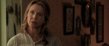 Movie still from “Open Range” (2003), directed by Kevin Costner – A person in a room near a wall; Close Up shot, Over the shoulder angle