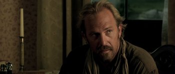 Movie still from “Open Range” (2003), directed by Kevin Costner – A person with a beard; Close Up shot, Over the shoulder angle