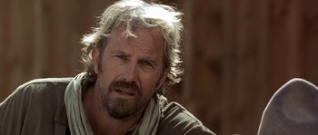 Movie still from “Open Range” (2003), directed by Kevin Costner – A person with a beard; Close Up shot, Over the shoulder angle