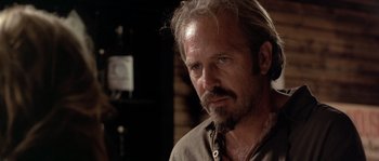 Movie still from “Open Range” (2003), directed by Kevin Costner – A person with a beard; Close Up shot, Over the shoulder angle