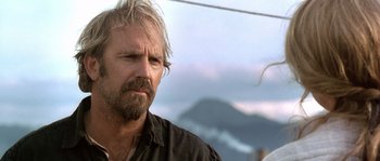 Movie still from “Open Range” (2003), directed by Kevin Costner – A person wearing a black shirt; Close Up shot, Low angle
