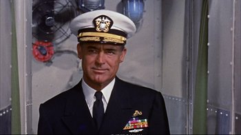 Movie still from “Operation Petticoat” (1959), directed by Blake Edwards – A person wearing a uniform; Medium shot, Low angle