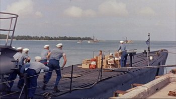 Movie still from “Operation Petticoat” (1959), directed by Blake Edwards – A group of men standing on top of a boat; Wide shot, High angle