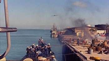 Movie still from “Operation Petticoat” (1959), directed by Blake Edwards – A group of people on a boat in the water; Extreme Wide shot, High angle