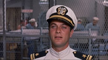 Movie still from “Operation Petticoat” (1959), directed by Blake Edwards – A person wearing a uniform; Close Up shot, Low angle