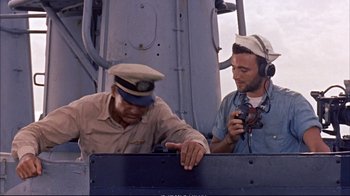Movie still from “Operation Petticoat” (1959), directed by Blake Edwards – Two men in hats are on a boat; Medium shot, High angle