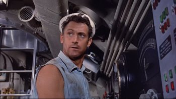 Movie still from “Operation Petticoat” (1959), directed by Blake Edwards – A person wearing a hard hat; Medium shot, Low angle
