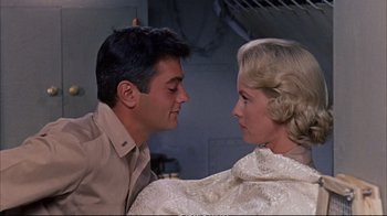 Movie still from “Operation Petticoat” (1959), directed by Blake Edwards – A man and a woman looking at one another; Close Up shot, Low angle