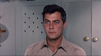 Movie still from “Operation Petticoat” (1959), directed by Blake Edwards – A person wearing a brown shirt; Close Up shot, High angle