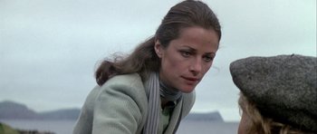 Movie still from “Orca” (1977), directed by Michael Anderson – A person with long hair; Close Up shot, Low angle