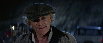 Movie still from “Orca” (1977), directed by Michael Anderson – A person wearing a hat; Close Up shot, Low angle
