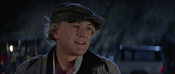 Movie still from “Orca” (1977), directed by Michael Anderson – A person wearing a hat; Close Up shot, Low angle