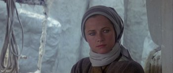 Movie still from “Orca” (1977), directed by Michael Anderson – A person wearing a scarf; Close Up shot, Low angle