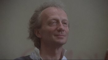 Movie still from “Orchestra Rehearsal” (1978), directed by Federico Fellini – A person looking up at the sky; Close Up shot, Low angle