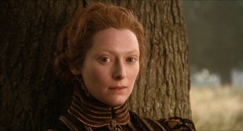 Movie still from “Orlando” (1992), directed by Sally Potter – Tilda swinton in the movie the dressmaker; Close Up shot, High angle