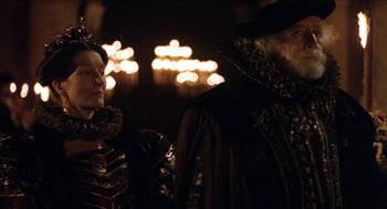 Movie still from “Orlando” (1992), directed by Sally Potter – A man and a woman dressed up in costumes; Medium shot, Over the shoulder angle