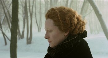 Movie still from “Orlando” (1992), directed by Sally Potter – A person wearing a black jacket; Close Up shot, Low angle