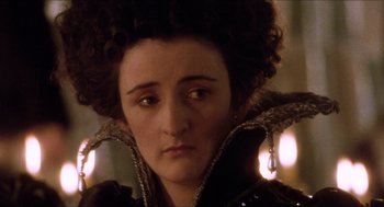 Movie still from “Orlando” (1992), directed by Sally Potter – A person wearing a costume; Close Up shot, Over the shoulder angle