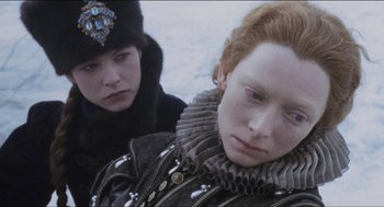 Movie still from “Orlando” (1992), directed by Sally Potter – Two people are looking at each other in the snow; Close Up shot, Over the shoulder angle