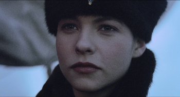 Movie still from “Orlando” (1992), directed by Sally Potter – A person wearing a hat; Close Up shot, Over the shoulder angle