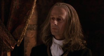 Movie still from “Orlando” (1992), directed by Sally Potter – A person with long hair; Close Up shot, Over the shoulder angle