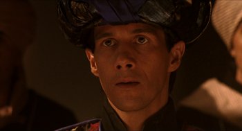 Movie still from “Orlando” (1992), directed by Sally Potter – A person wearing a hat; Close Up shot, Low angle