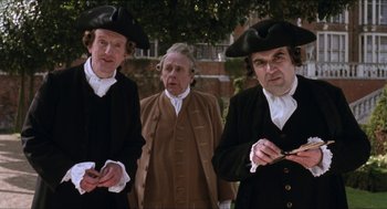 Movie still from “Orlando” (1992), directed by Sally Potter – A group of men standing next to each other; Medium shot, Low angle
